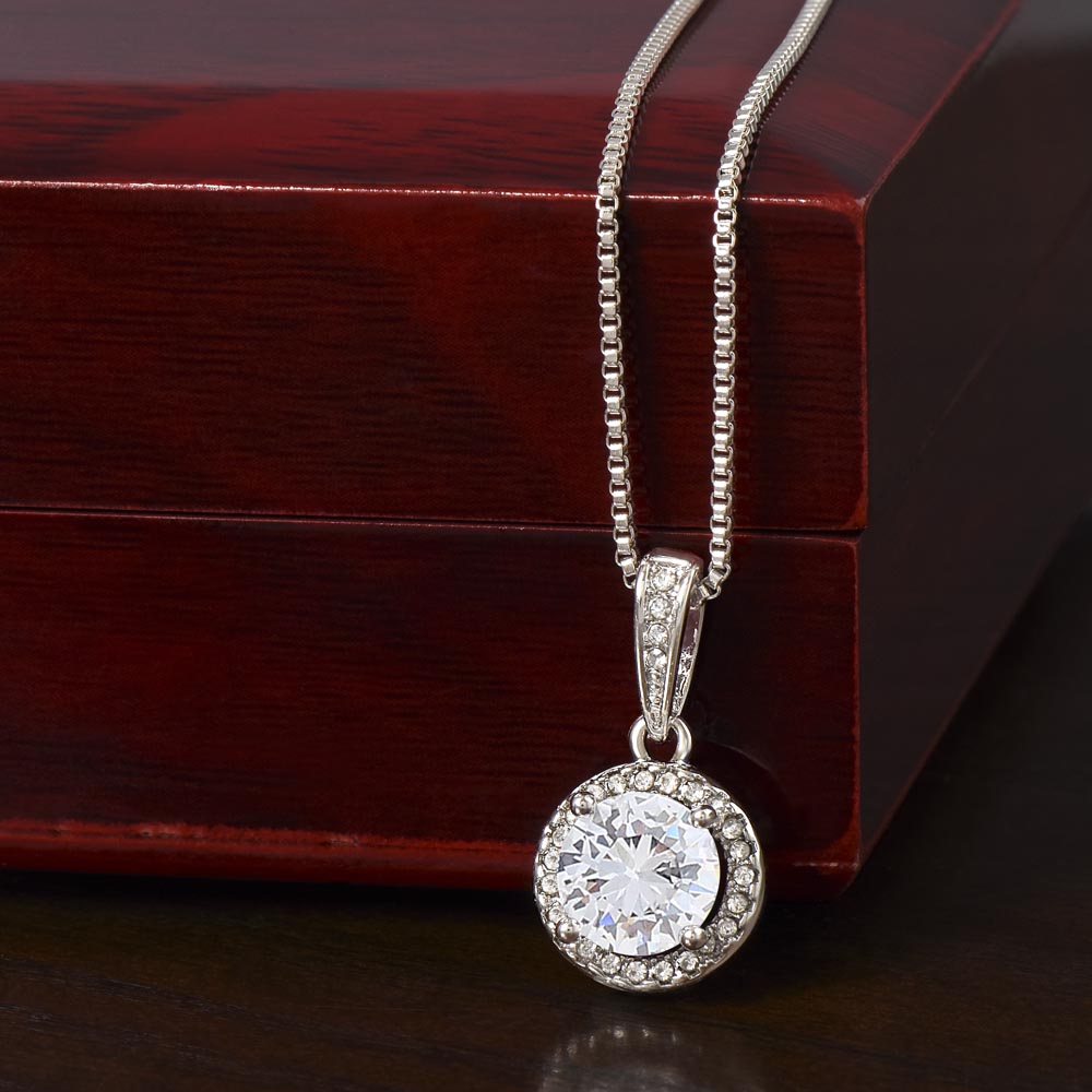 Eternal Home Necklace draped over luxury gift box