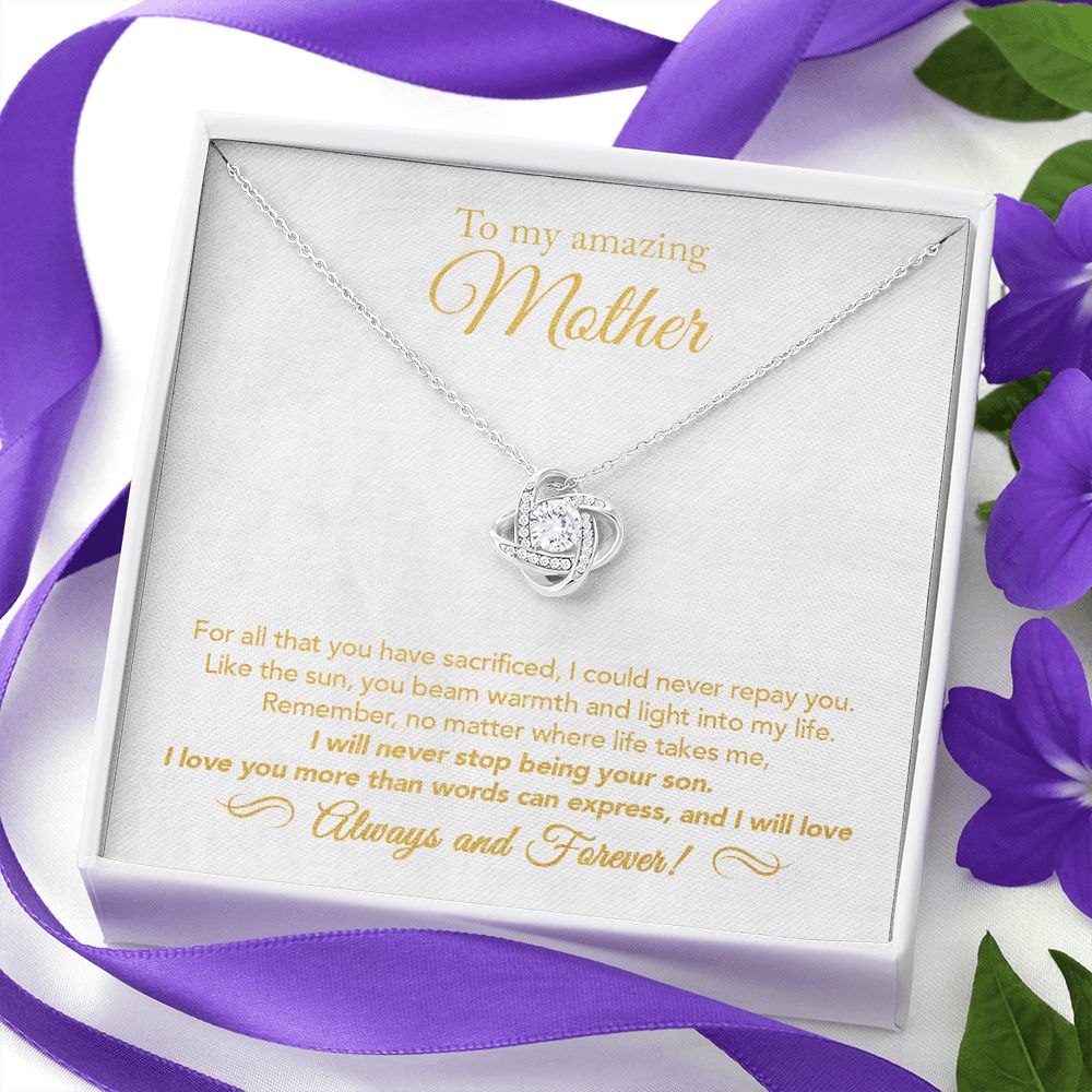 14K White Gold Finish Love Knot Necklace in Two-Toned Gift Box as a gift for mother from son surrounded by purple gift wrapping ribbons
