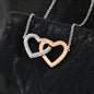 Interlocking Hearts Necklace Gift for daughter, Rose Gold & Stainless Steel on display